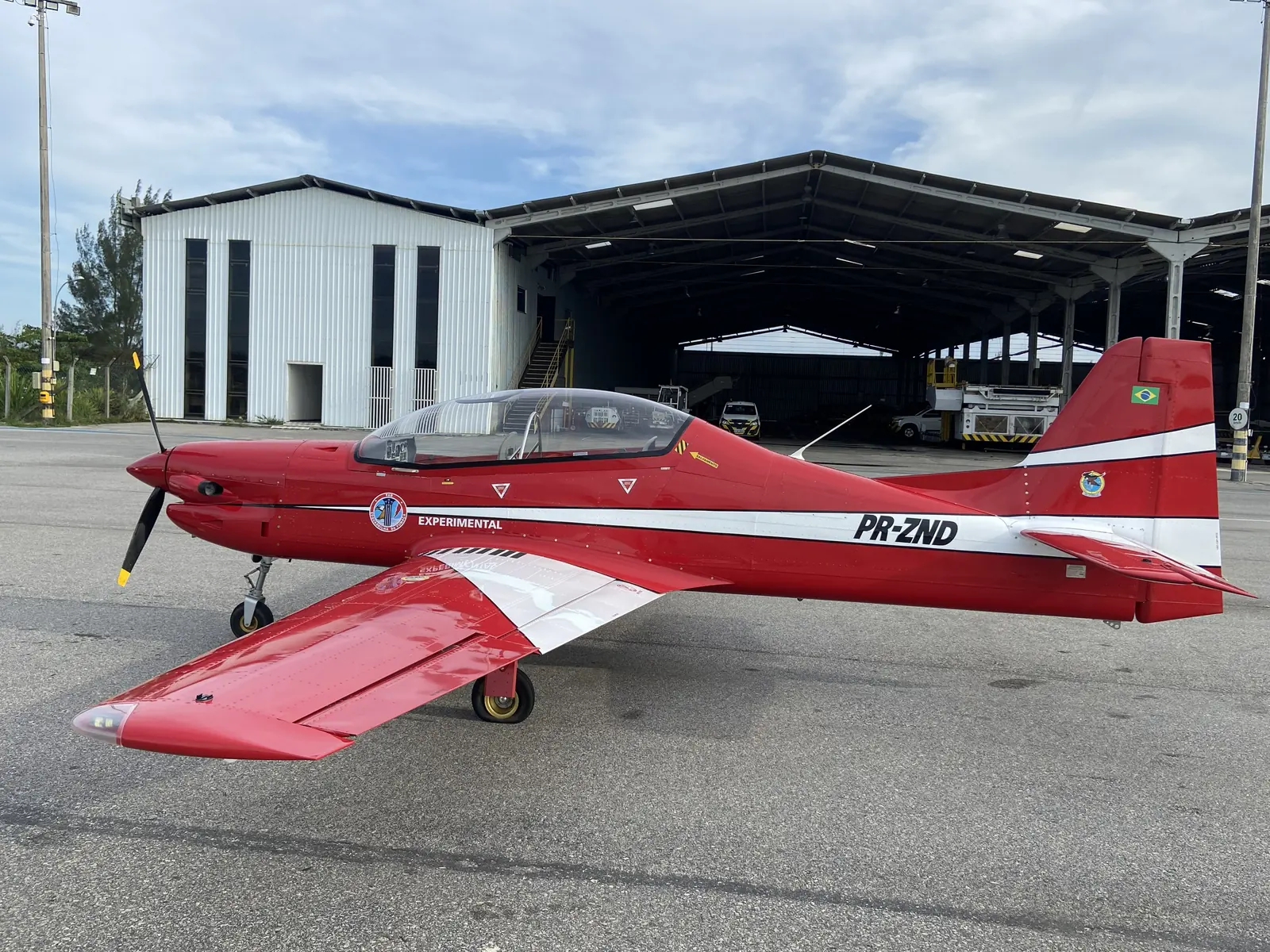 PR-ZND on the apron in front of a hangar at Cabo Frio, Rio de Janeiro